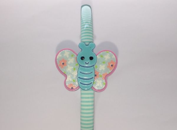 Patterned head band with butterfly shape