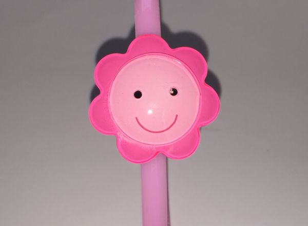 Head band with face patterned flower