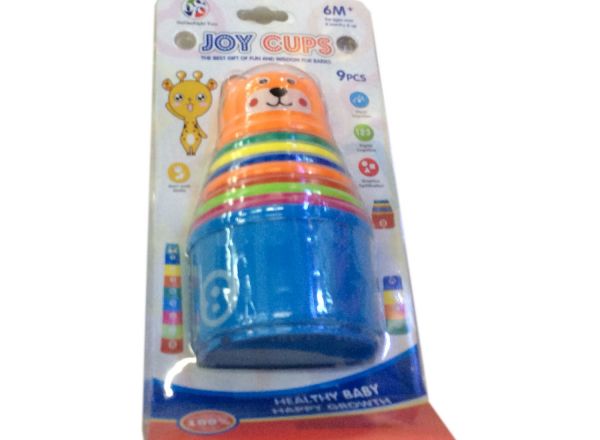 Baby stacking up cups