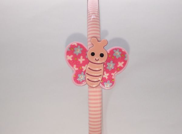 Patterned head band with butterfly shape