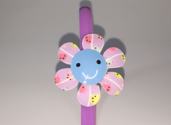 Head band with patterned flower shape