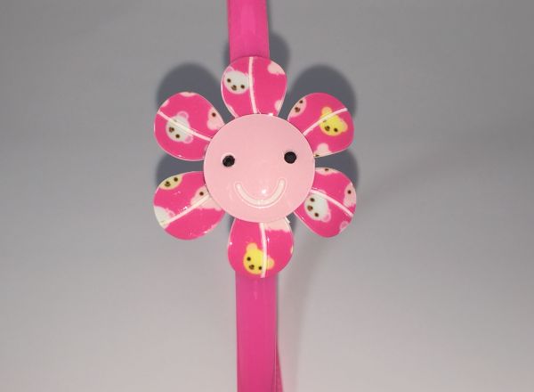 Head band with patterned flower shape