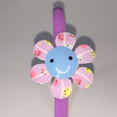 Head band with patterned flower shape