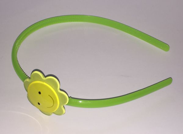 Head band with face patterned flower