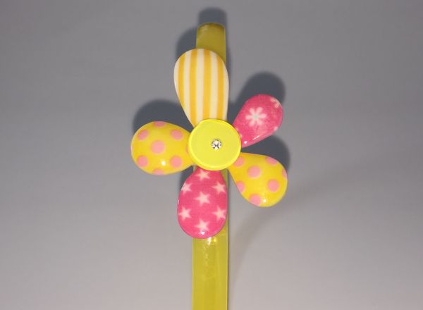 Head band with patterned flower shape