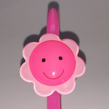 Head band with face patterned flower