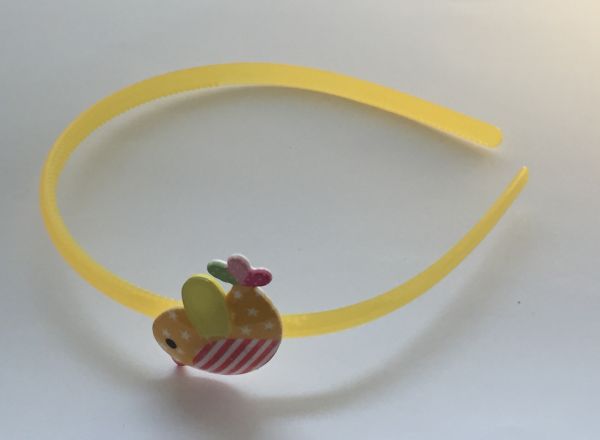 Head band with patterned bird shape