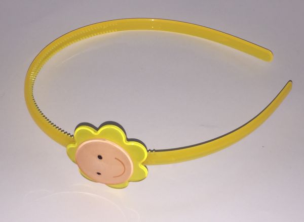 Head band with face patterned flower