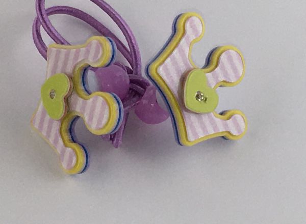 Elastics with crown shape
