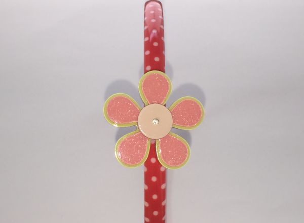 Polka dots patterned headband with flower shape