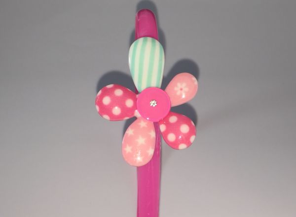Head band with patterned flower shape