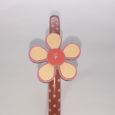 Polka dots patterned headband with flower shape