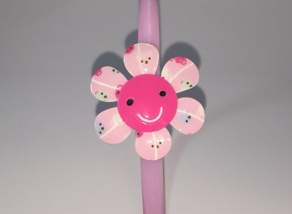 Head band with patterned flower shape