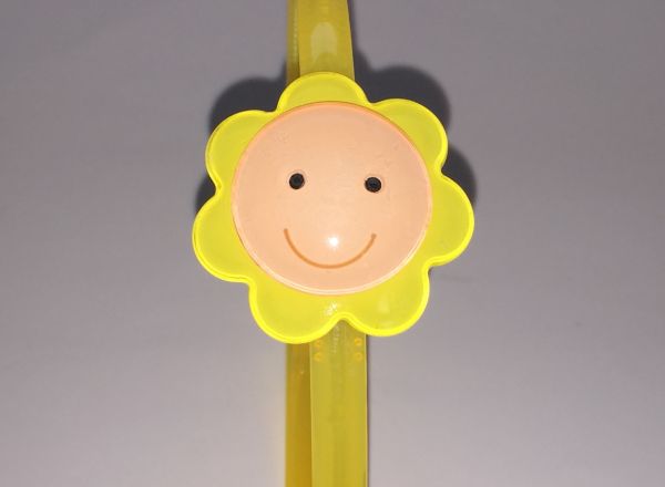 Head band with face patterned flower