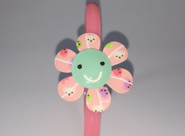 Head band with patterned flower shape
