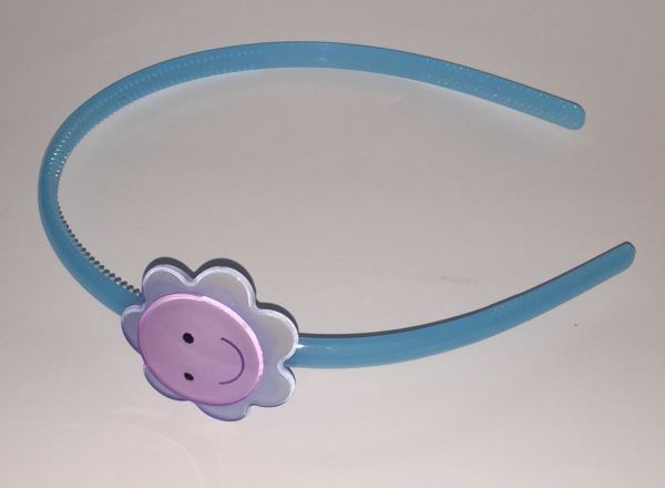Head band with face patterned flower