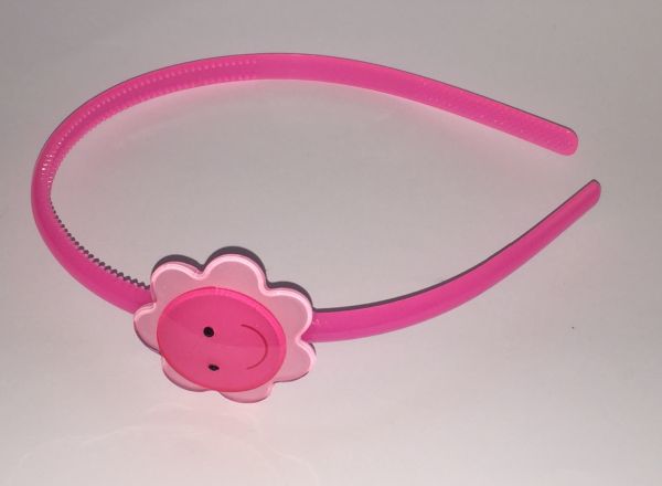 Head band with face patterned flower