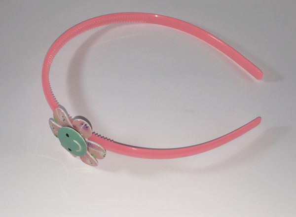 Head band with patterned flower shape