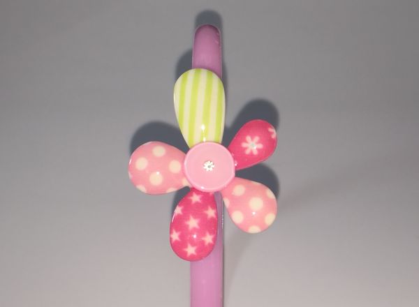 Head band with patterned flower shape