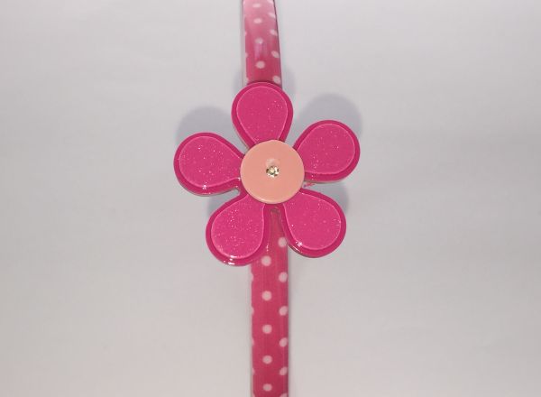 Polka dots patterned headband with flower shape