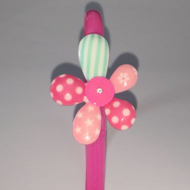 Head band with patterned flower shape