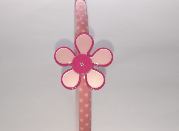 Polka dots patterned headband with flower shape