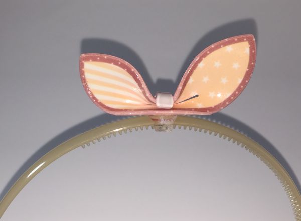 Head band with patterned bow