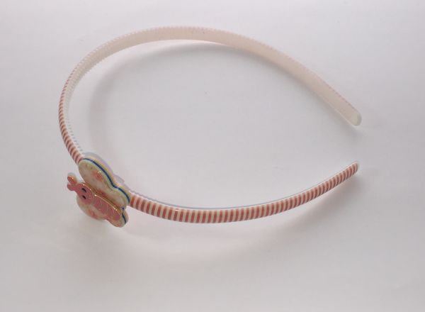 Patterned head band with butterfly shape