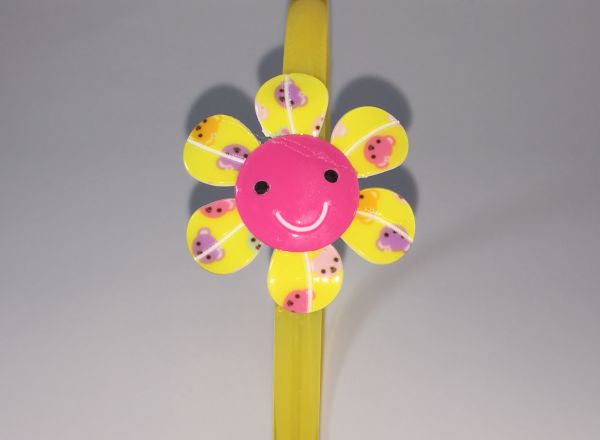 Head band with patterned flower shape