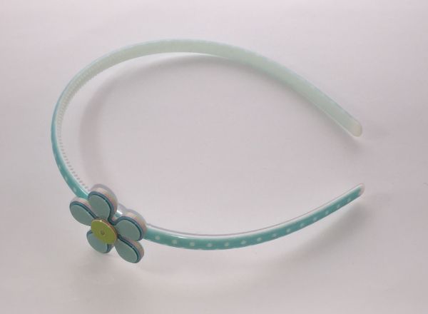 Polka dots patterned headband with flower shape