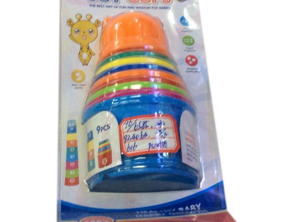 Baby stacking up cups