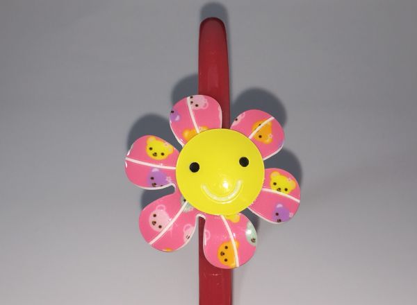Head band with patterned flower shape