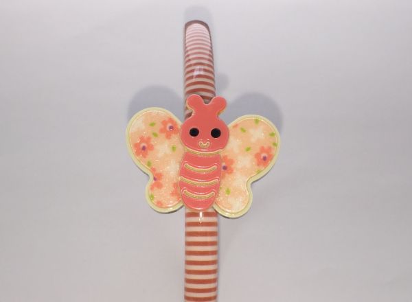 Patterned head band with butterfly shape