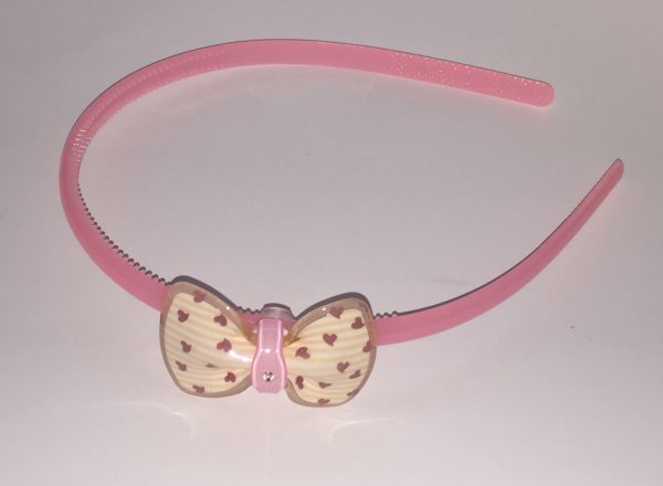Head band with patterned bow
