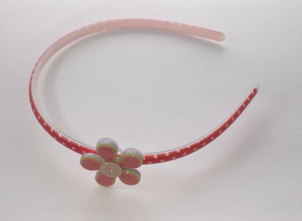 Polka dots patterned headband with flower shape