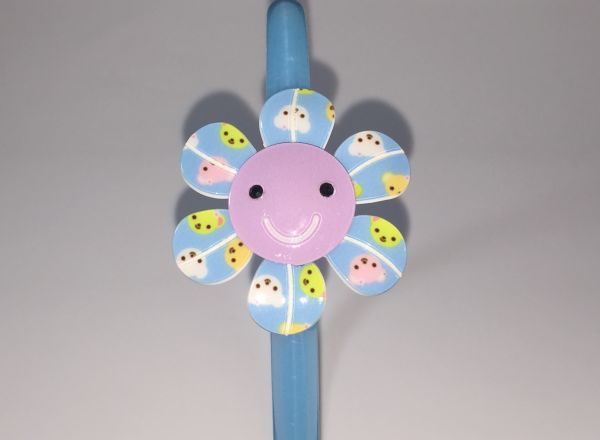 Head band with patterned flower shape