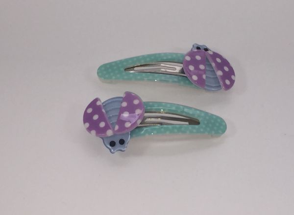 Patterned snap clip with ladybird