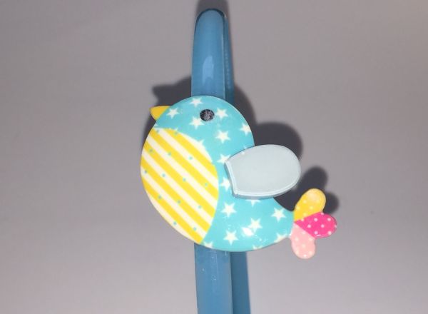 Head band with patterned bird shape