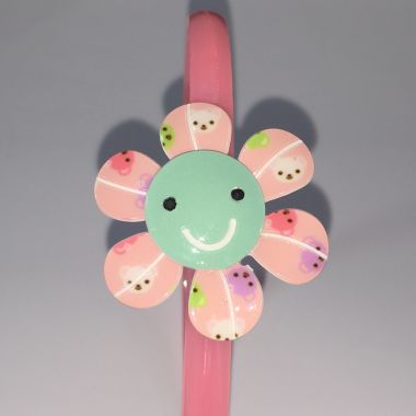 Head band with patterned flower shape